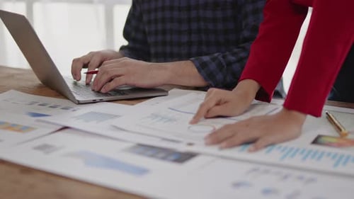 Close up of hands are working and brainstorming on paperwork about business financial and marketing.