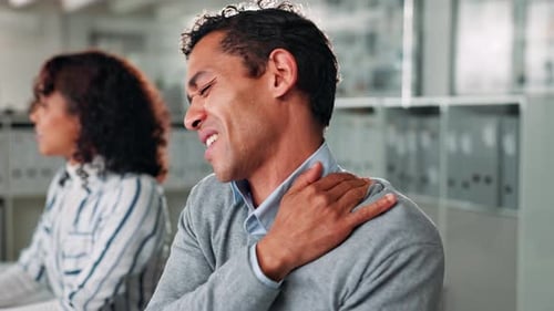 Businessman, injury and stress with shoulder pain for bad posture or overworked pressure at office