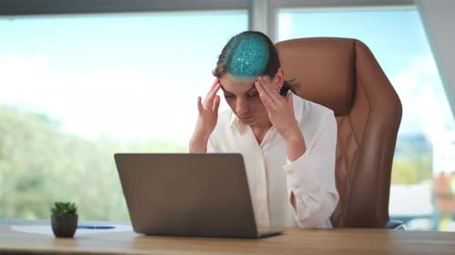 Businesswoman under stress at her laptop with severe headache rubs her temples. Digital animation of