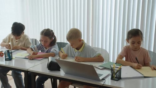 Diverse Kids Performing Test Tasks at School