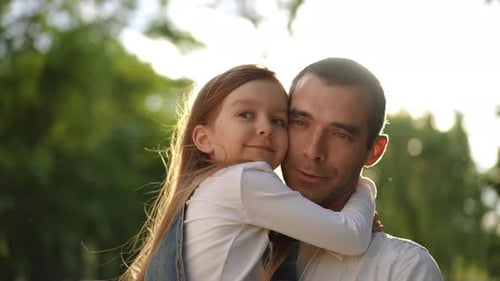 Loving Father and Daughter in Bright Green Park
