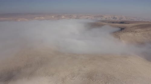 Fog over desert Mountains aerial view