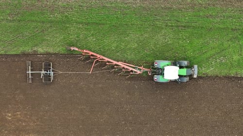 Aerial view of tractor ploughing in Brandenburg, Germany.