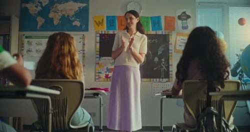 Female Teacher Presenting Elementary School Student for Giving Presentation on Ecology