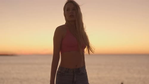 Woman at Sunrise By the Sea