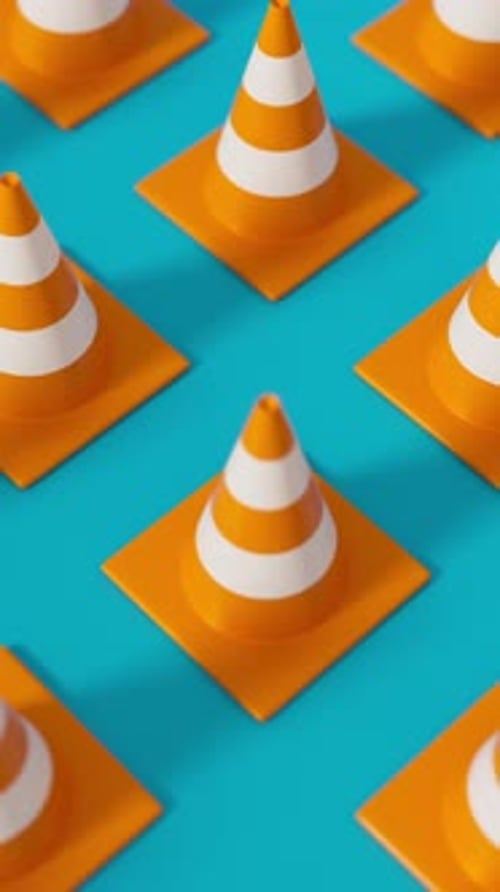 High Angle Grid of Traffic Cones in Orange on a Blue Background for Road Safety and Construction