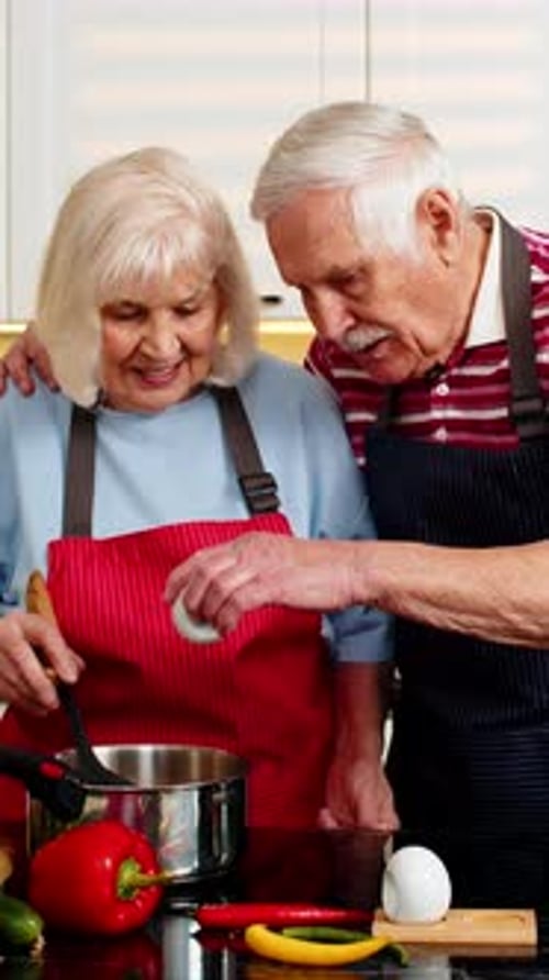 Senior Couple Cooking Together in Bright Kitchen