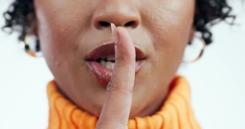 Hand, secret and woman in studio with whisper sign for announcement, promo