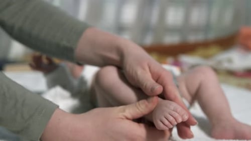 Baby Getting a Foot Massage Indoors
