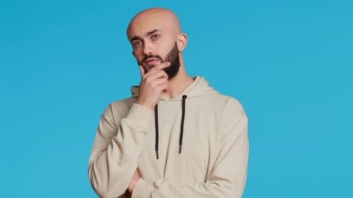 Bald Man Thinking with Hand on Face