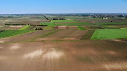 A dry agricultural field during spring, drone shot