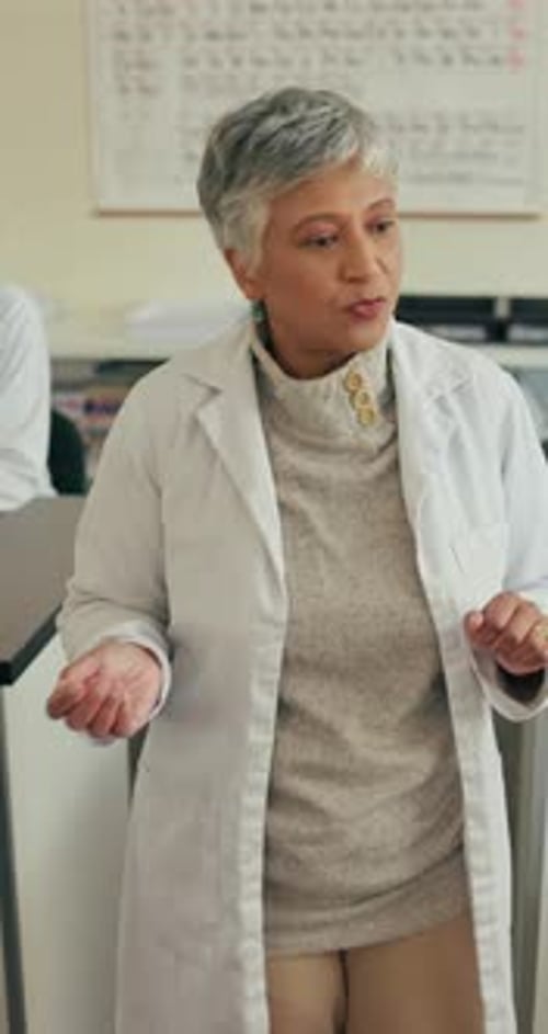 Education, teaching and walking with university lecturer in science class for knowledge