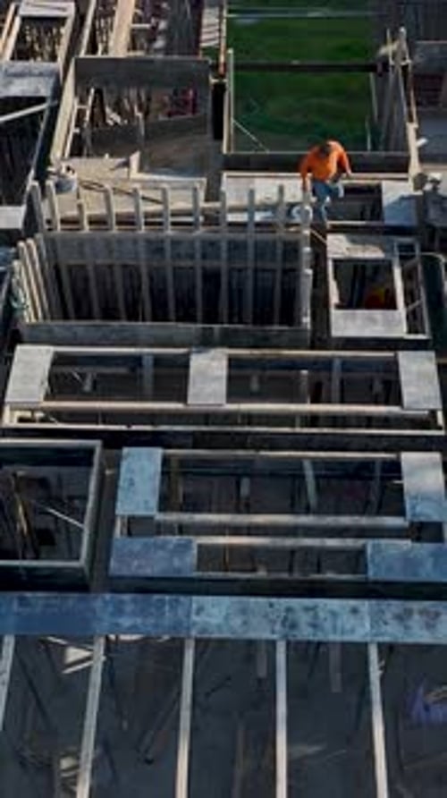 Vertical Drone View Building Under Construction with Clean Structural Lines and Depth