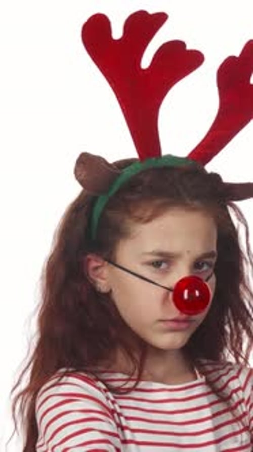 Resentful Girl in Festive Reindeer Costume with Red Nose