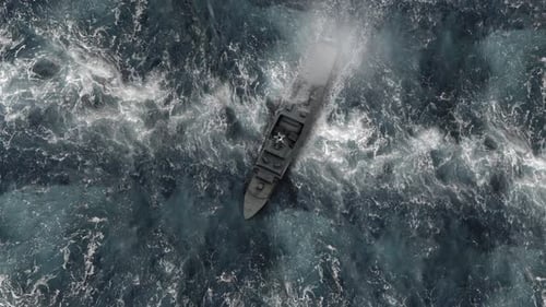 Navy ship vessel in stormy ocean with jets Aerial view