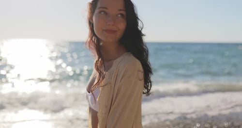 Slow Motion of Walking Young Asian Woman on Beach During Sea Vacation