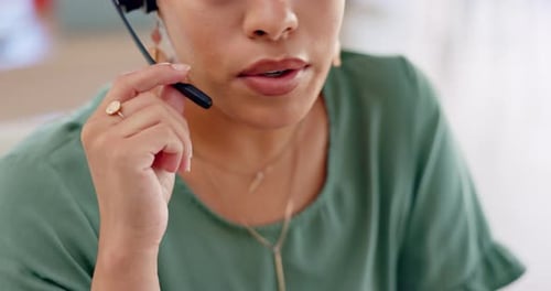 Woman Talks on Headset in Bright Workplace