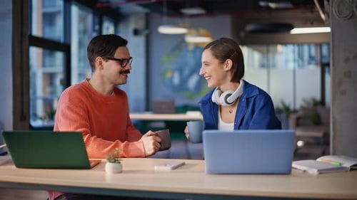 Friendly Coworkers Toasting Coffee Cups Talking at Agency Workplace Closeup
