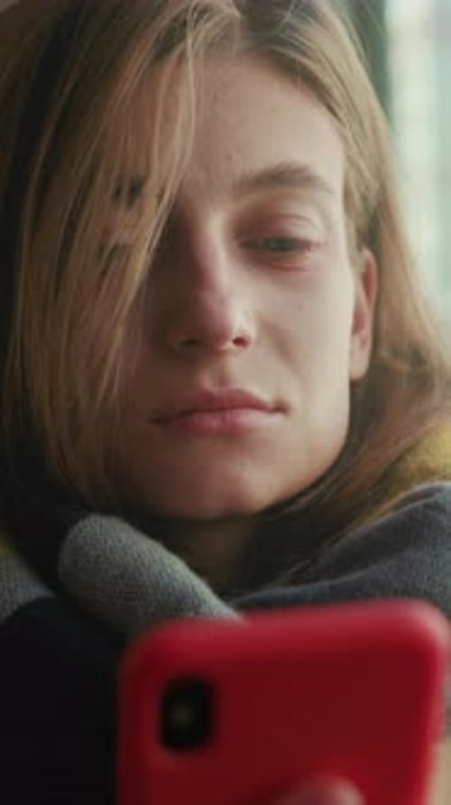 Woman Reads Emotional Message Candid Scene of Young Woman in Scarf Viewing Troubling Text Message