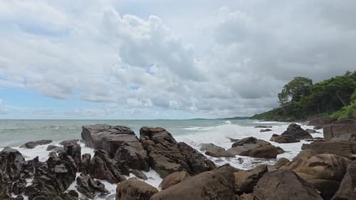 Waves crash rocks