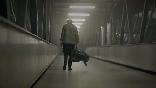 A Mysterious Figure in a Dimly Lit Tunnel at Night Creates an Eerie and Enigmatic Atmosphere