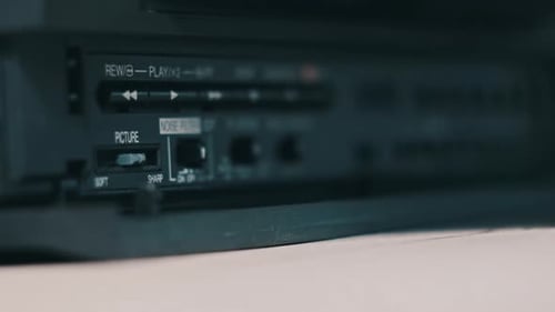 Insert VHS Cassette Into VCR Video Player