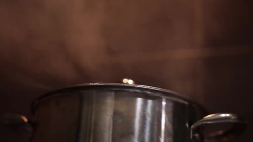Smoke Emerging From a Steaming Pot - Close Up
