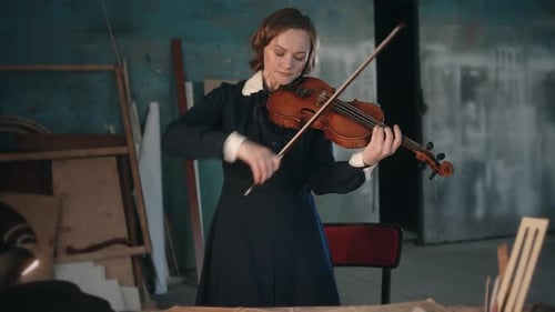Woman Playing Violin in Grungy Studio