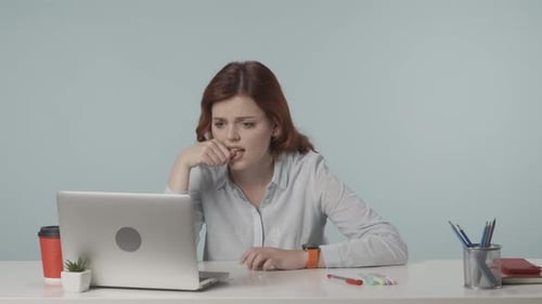 Woman Frustrated While Working at Computer in Office