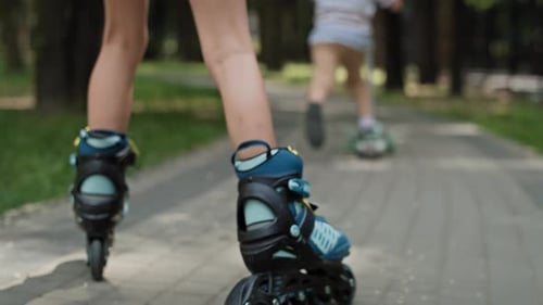 Close up of kids skating at the park in summer day. Shot with RED helium camera in 8K.