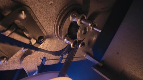 Film Reel Spinning Through a Projector