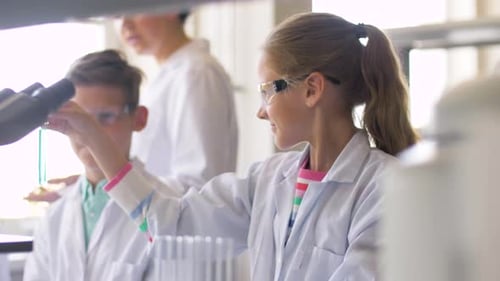 Children Conducting Science Experiments in a School Lab
