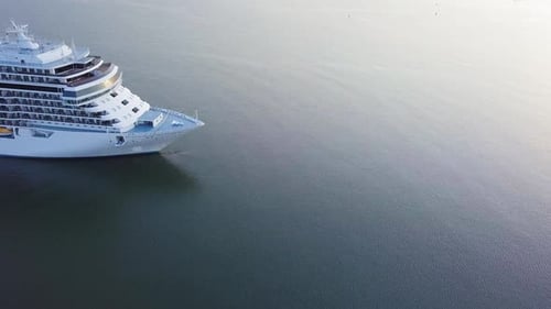 Aerial view of large white cruise liner Seven Seas Splendor arriving at the port of Liepaja (Latvia)