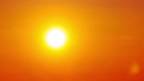 Vibrant Sunset Time Lapse Over Dark Horizon