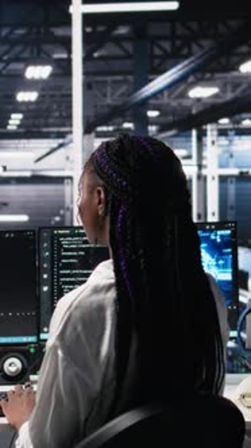 Vertical Video Technicians in Data Center Review AI Diagnostics Analyzing Neural Networks