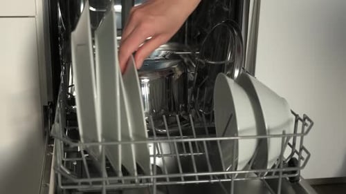 Dishwasher with Clean Dishes in Kitchen
