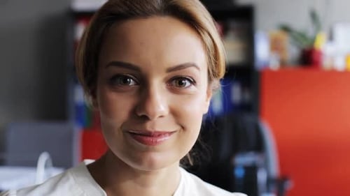 Smiling Woman Portrait in the Workplace Close Up
