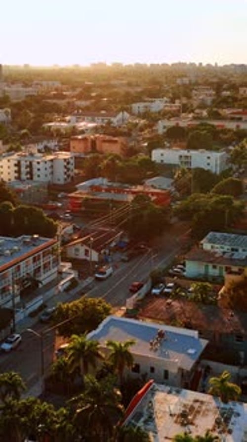 Residential area in Miami with multiple low-rise buildings and lots of trees.
