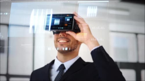Young man using VR glasses in futuristic office