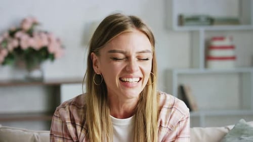 Young Woman Laughing Candidly Indoors