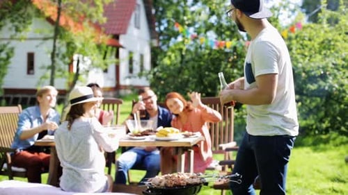 Friends Gather Outdoors at Backyard Barbecue Party