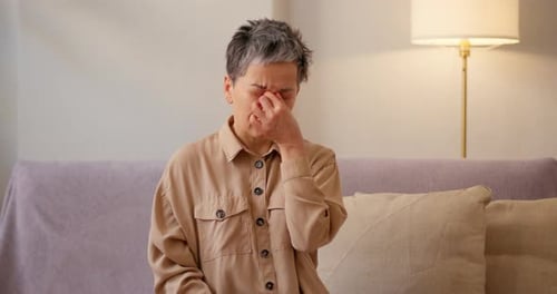 Woman Experiences a Headache