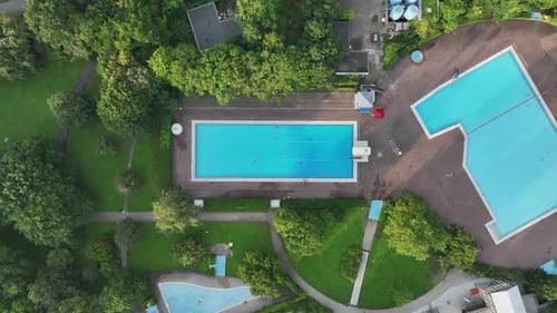Aerial view of public pools surrounded by greenery, Germany.