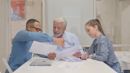 Close up of Business People Working on Documents