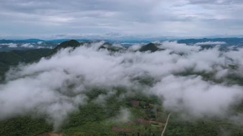 Aerial view morning scenery Mist flowing over the high mountains.