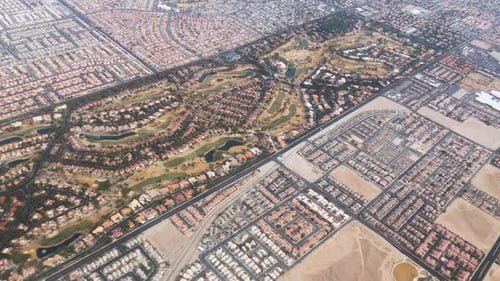 Aerial High Angle View Of Luxury Golf Course Suburban Neighborhood