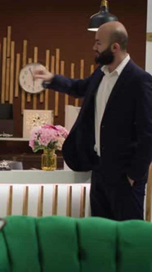 Man Wearing Suit in Hotel Lobby