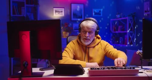 Adult Mixing Audio with Soundboard in a Blue Room