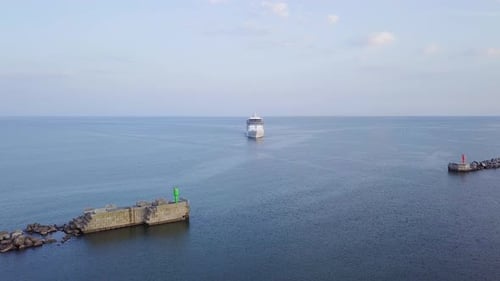 Aerial view of large white cruise liner Seven Seas Splendor arriving at the port of Liepaja (Latvia)