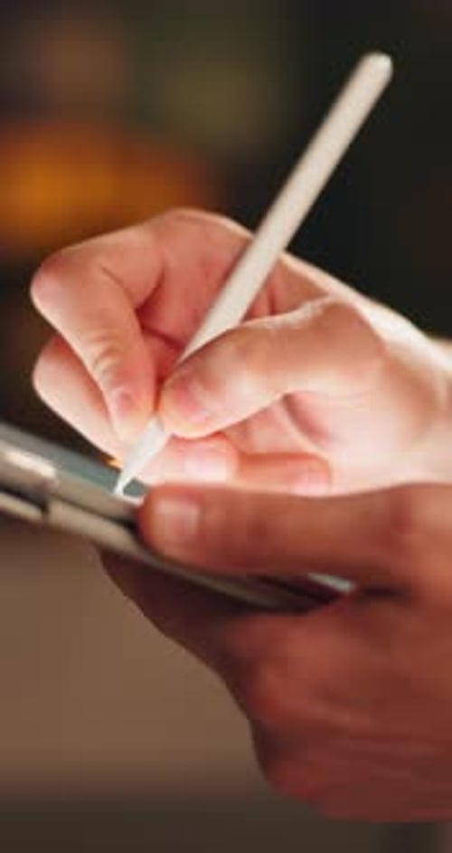 Hand Using Stylus on Tablet Device for Digital Art